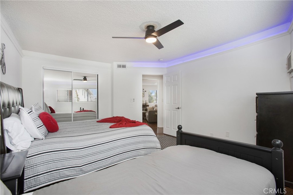 140 Avenida Algodon, Unit C San Clemente, CA 92672 - Photo 7 of 14 a bedroom with a bed and a flat screen tv