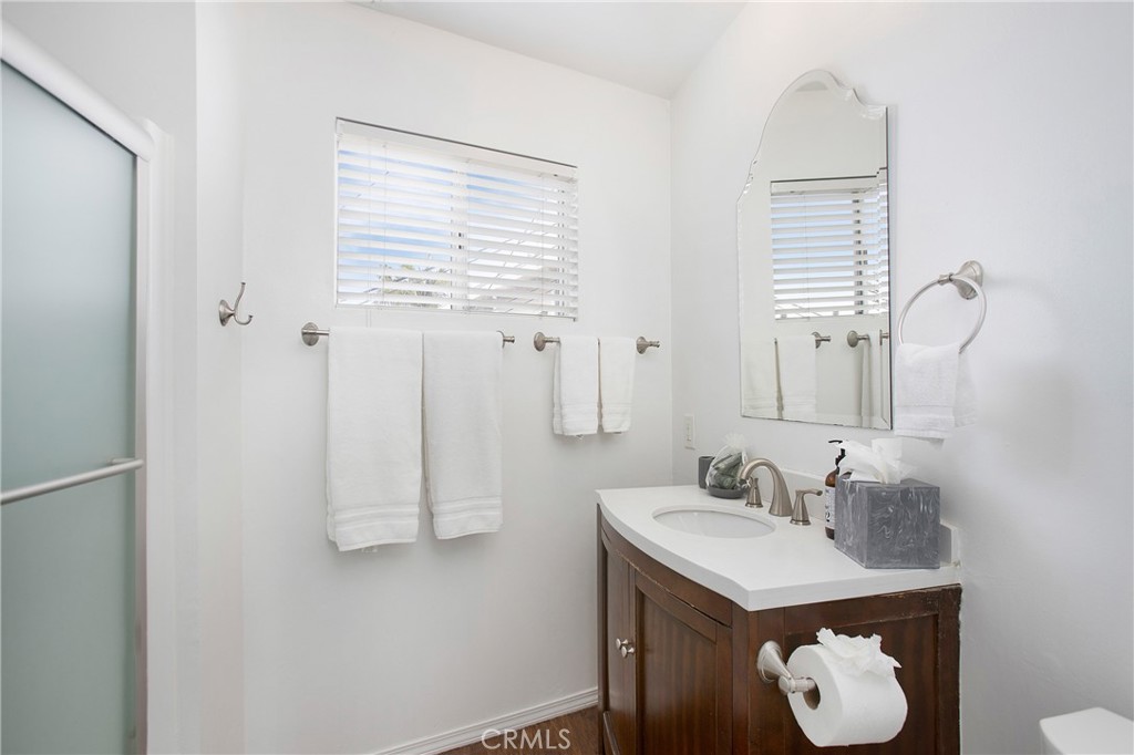 140 Avenida Algodon, Unit C San Clemente, CA 92672 - Photo 8 of 14 a bathroom with a sink and a mirror