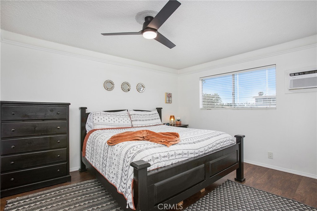 140 Avenida Algodon, Unit C San Clemente, CA 92672 - Photo 9 of 14 a bedroom with a bed and a dresser