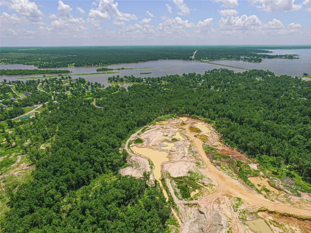 a view of a lake with a big yard