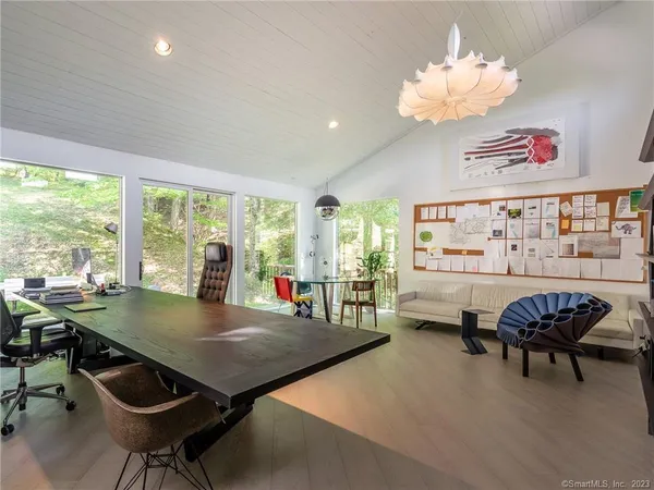 a view of a dining room with furniture window and outside view