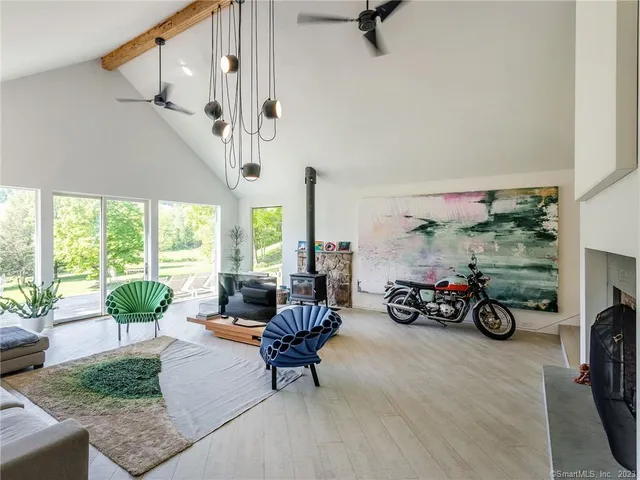 a view of a livingroom with furniture water and a patio