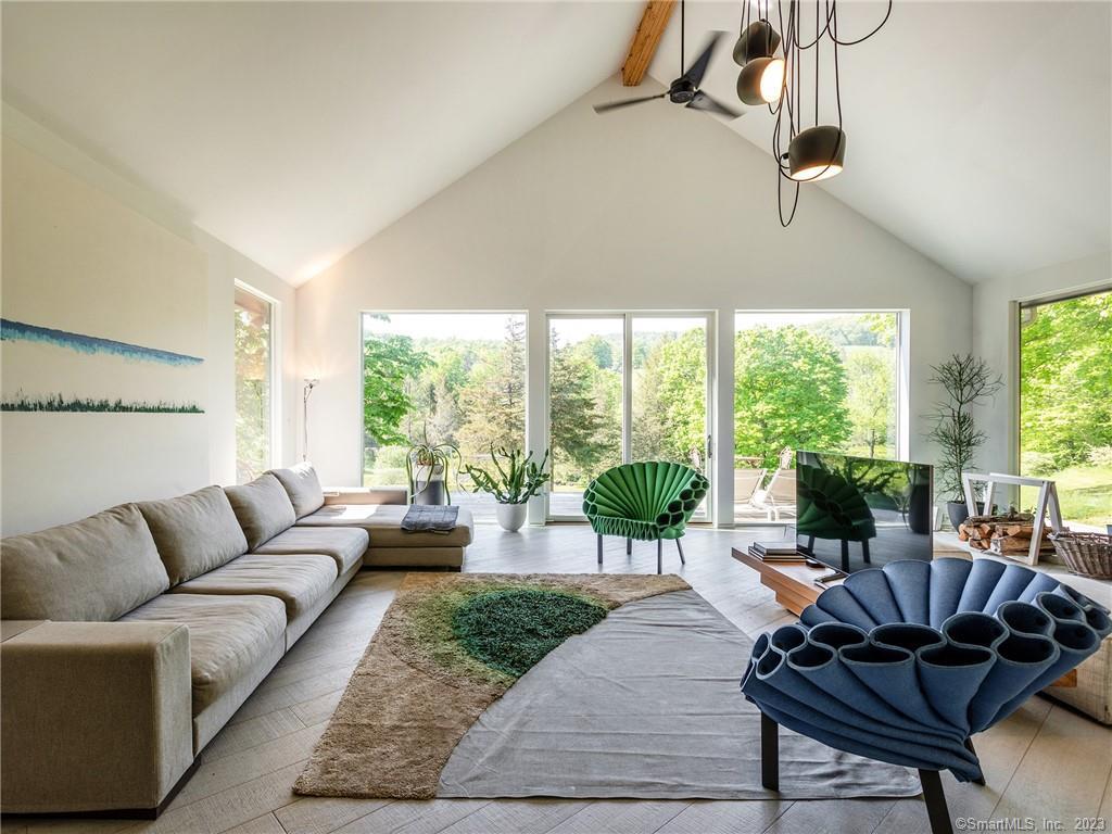 110 Geer Mountain Road Kent, CT 06785 - Photo 2 of 40 a living room with furniture and a large window