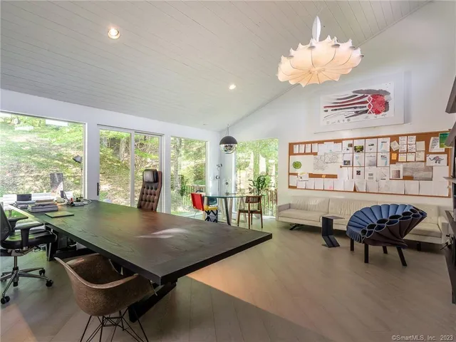 a view of a dining room with furniture window and outside view