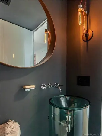 a bathroom with a sink and mirror