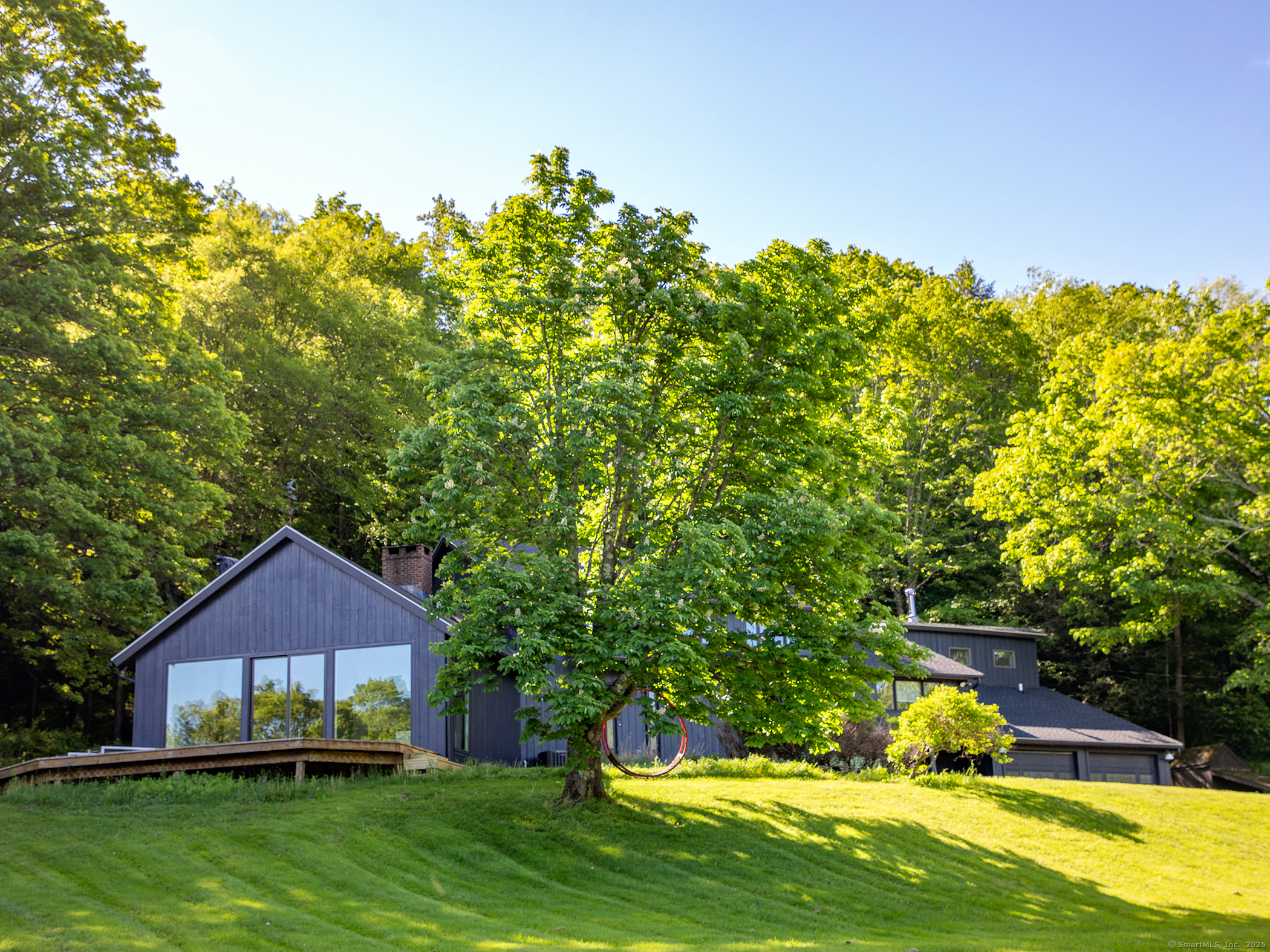 110 Geer Mountain Road Kent, CT 06785 - Photo 5 of 40 a backyard of a house with yard and outdoor seating