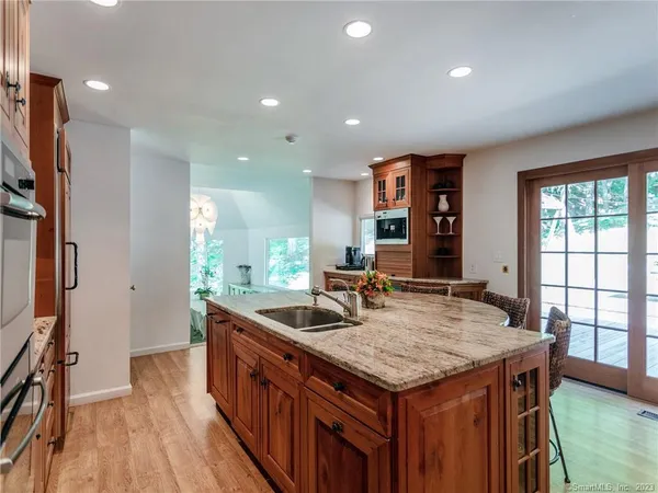 a kitchen with granite countertop a stove and a sink