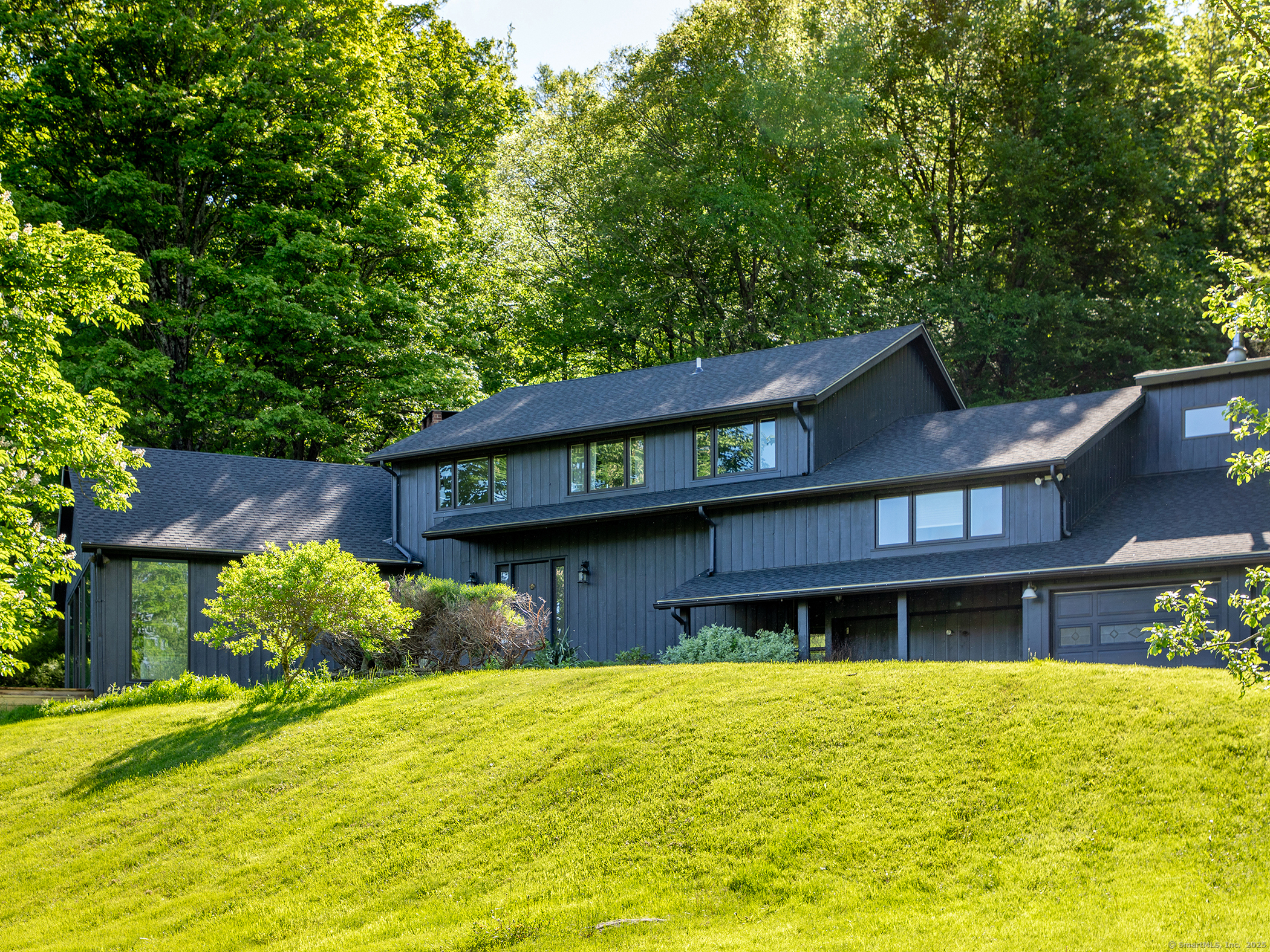 110 Geer Mountain Road Kent, CT 06785 - Photo 6 of 40 a front view of a house with a yard