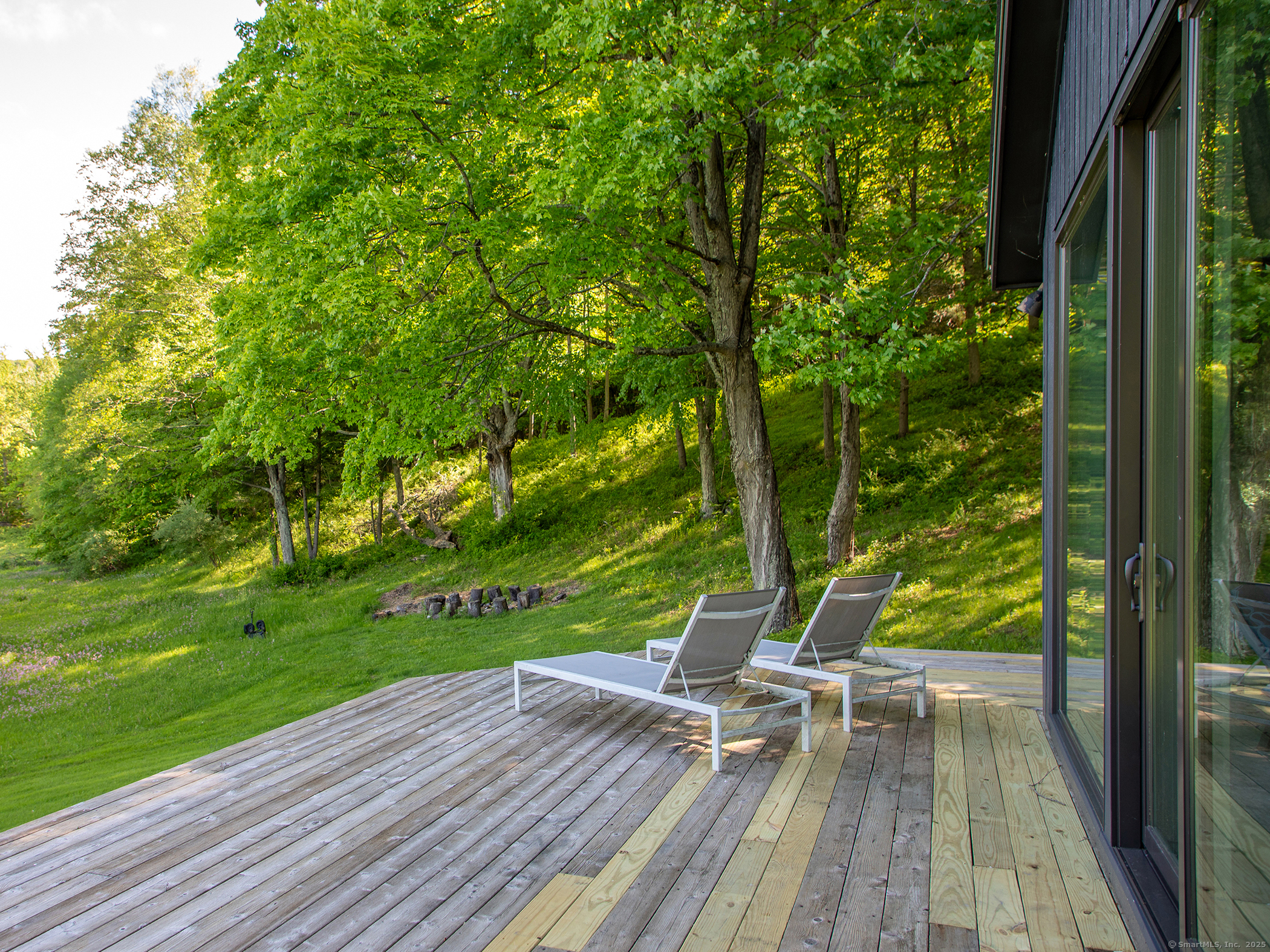 110 Geer Mountain Road Kent, CT 06785 - Photo 7 of 40 a view of a wooden deck with a yard