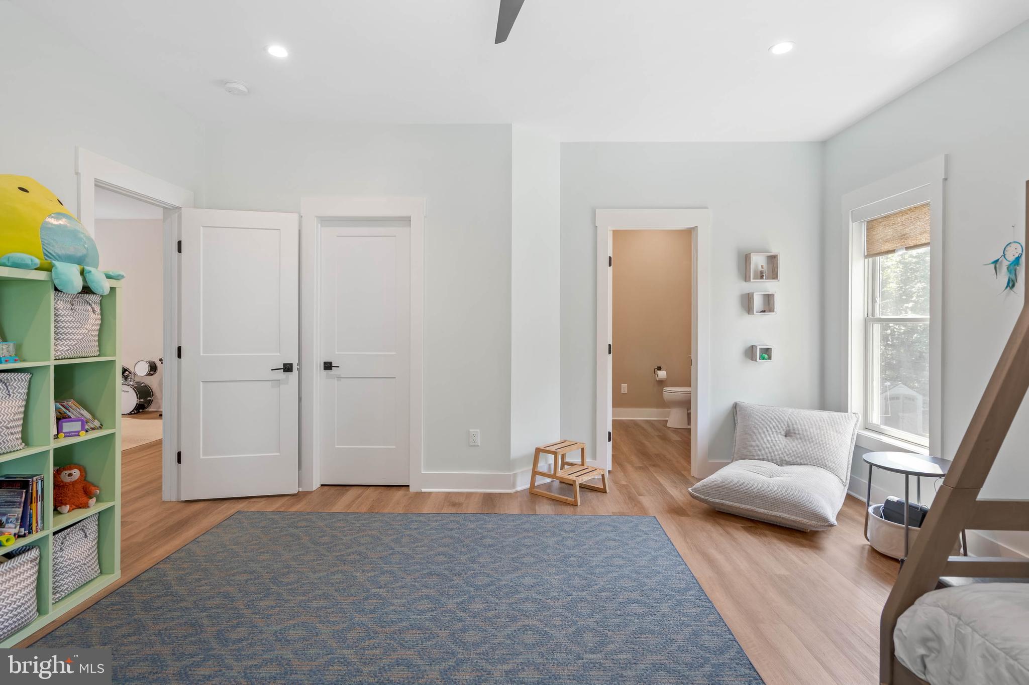 38155 Muddy Neck Road Ocean View, DE 19970 - Photo 11 of 67 a bedroom with furniture and a book shelf
