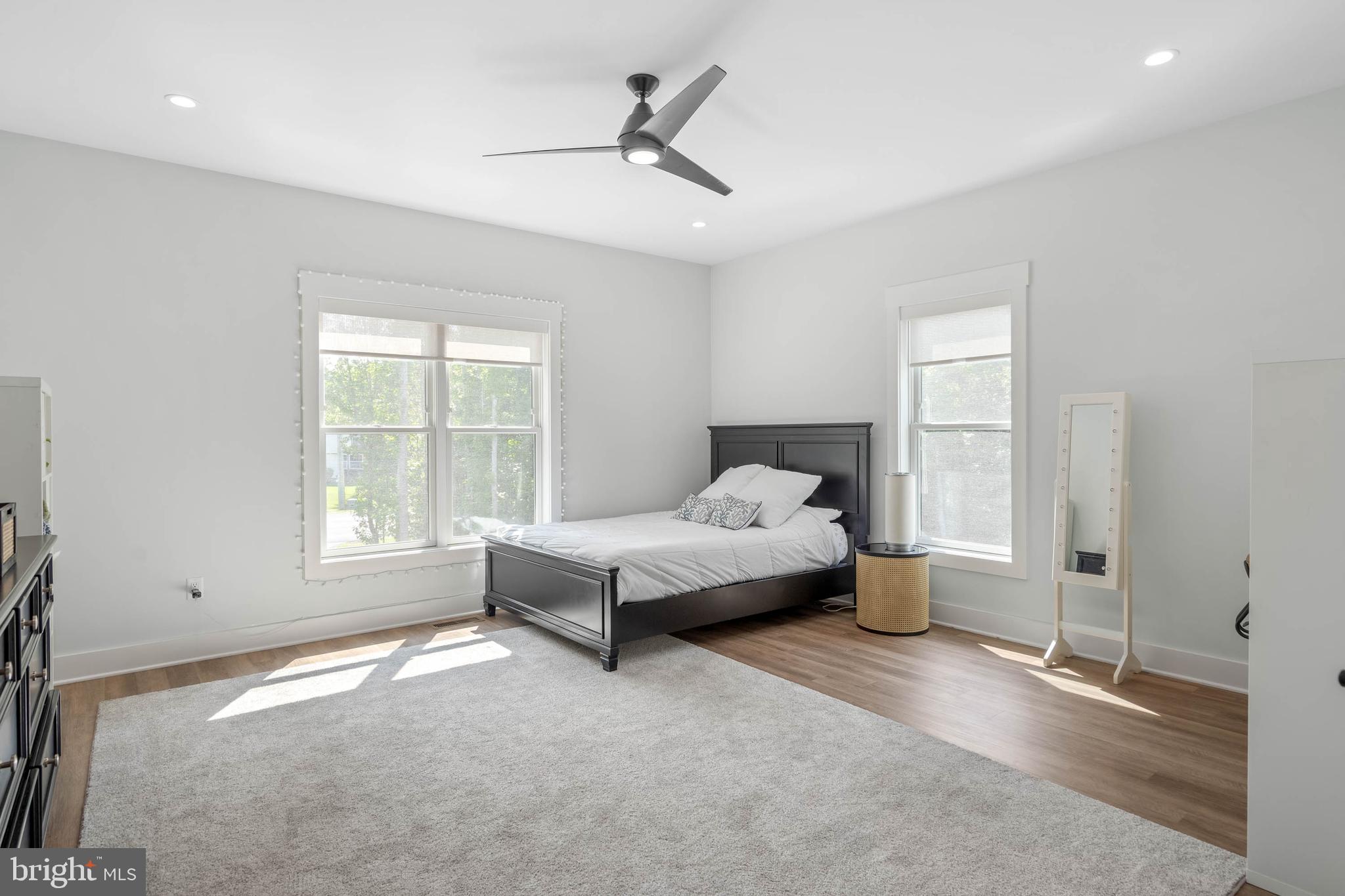 38155 Muddy Neck Road Ocean View, DE 19970 - Photo 14 of 67 a spacious bedroom with a bed and a window