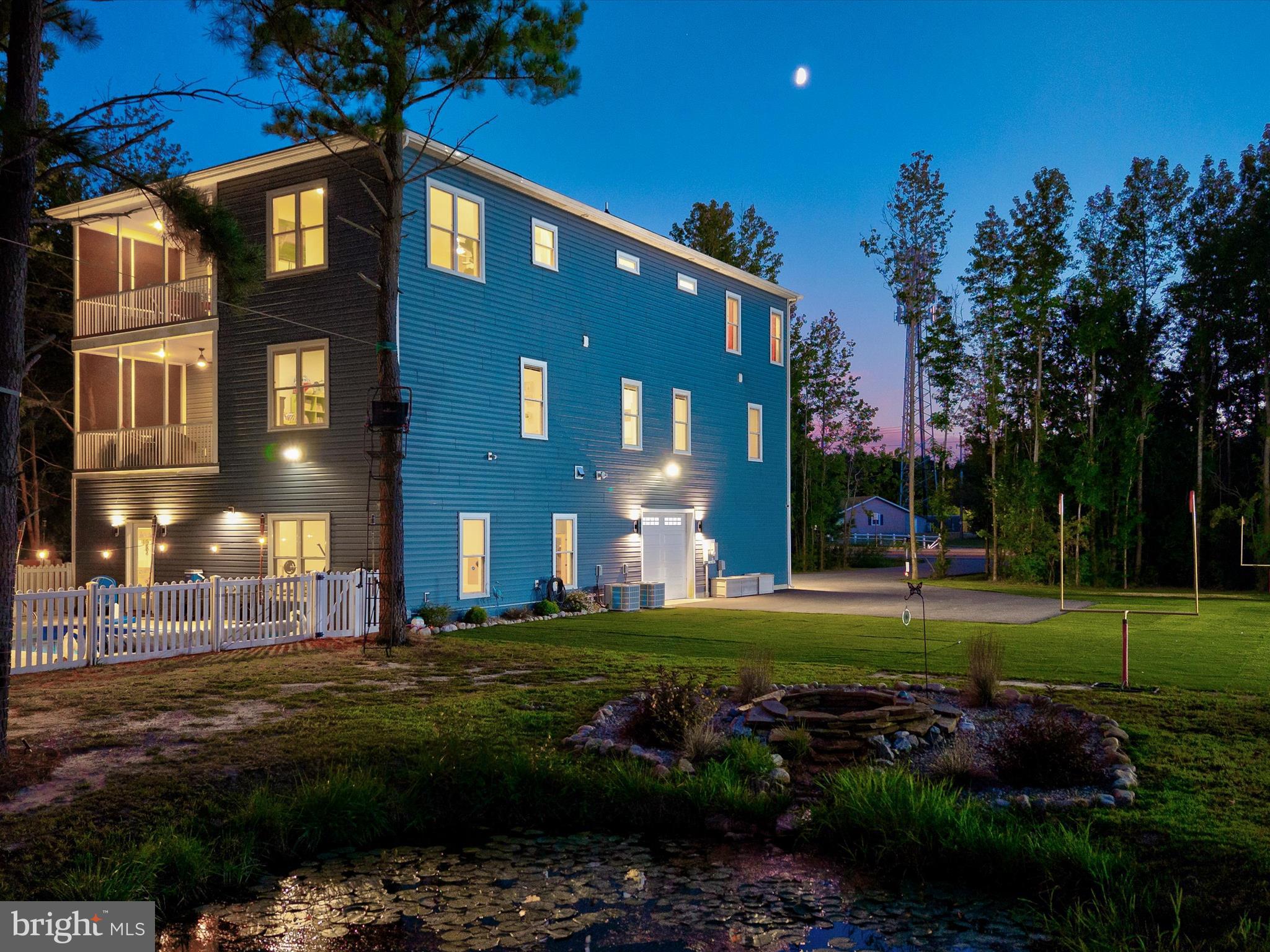 38155 Muddy Neck Road Ocean View, DE 19970 - Photo 2 of 67 a view of a building with a yard