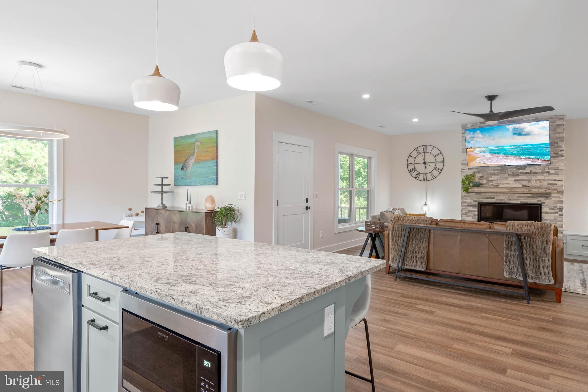 38155 Muddy Neck Road Ocean View, DE 19970 - Photo 25 of 67 a kitchen with sink cabinets and wooden floor