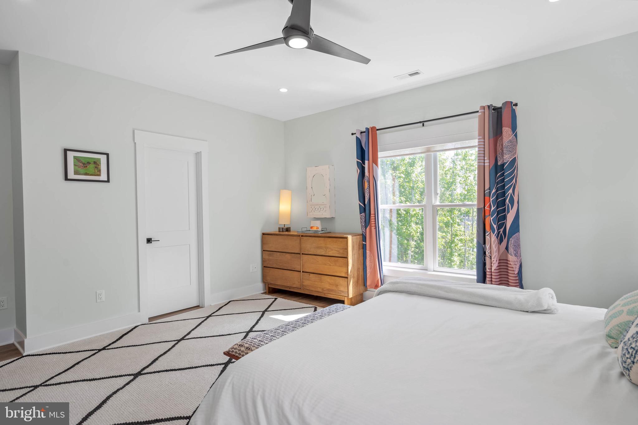 38155 Muddy Neck Road Ocean View, DE 19970 - Photo 32 of 67 a bedroom with a bed and a window