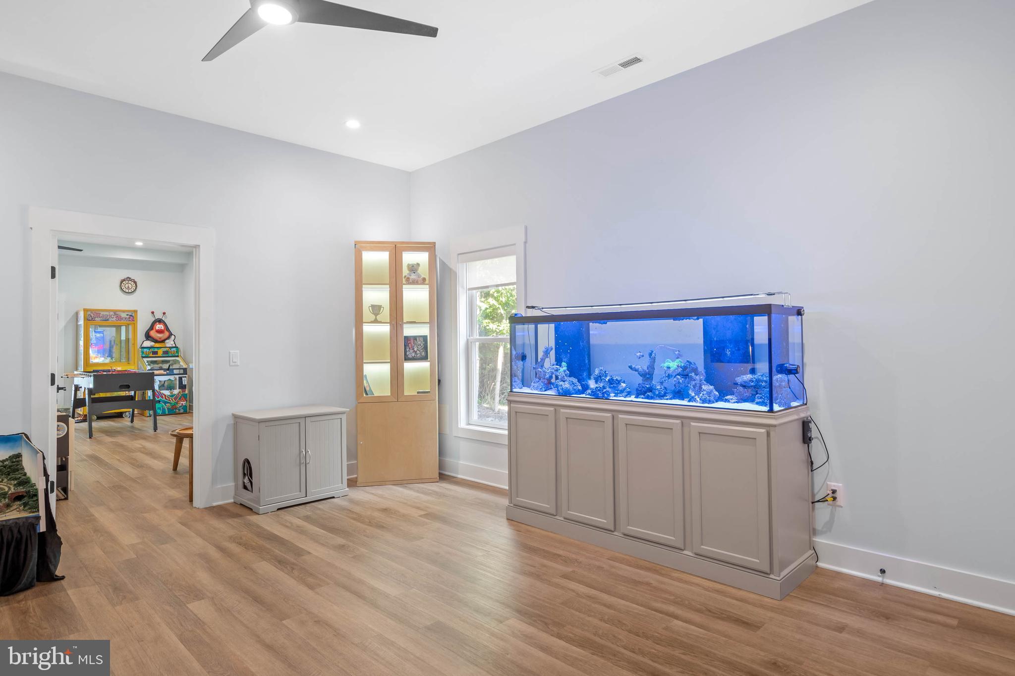 38155 Muddy Neck Road Ocean View, DE 19970 - Photo 36 of 67 an empty room with wooden floor and cabinet