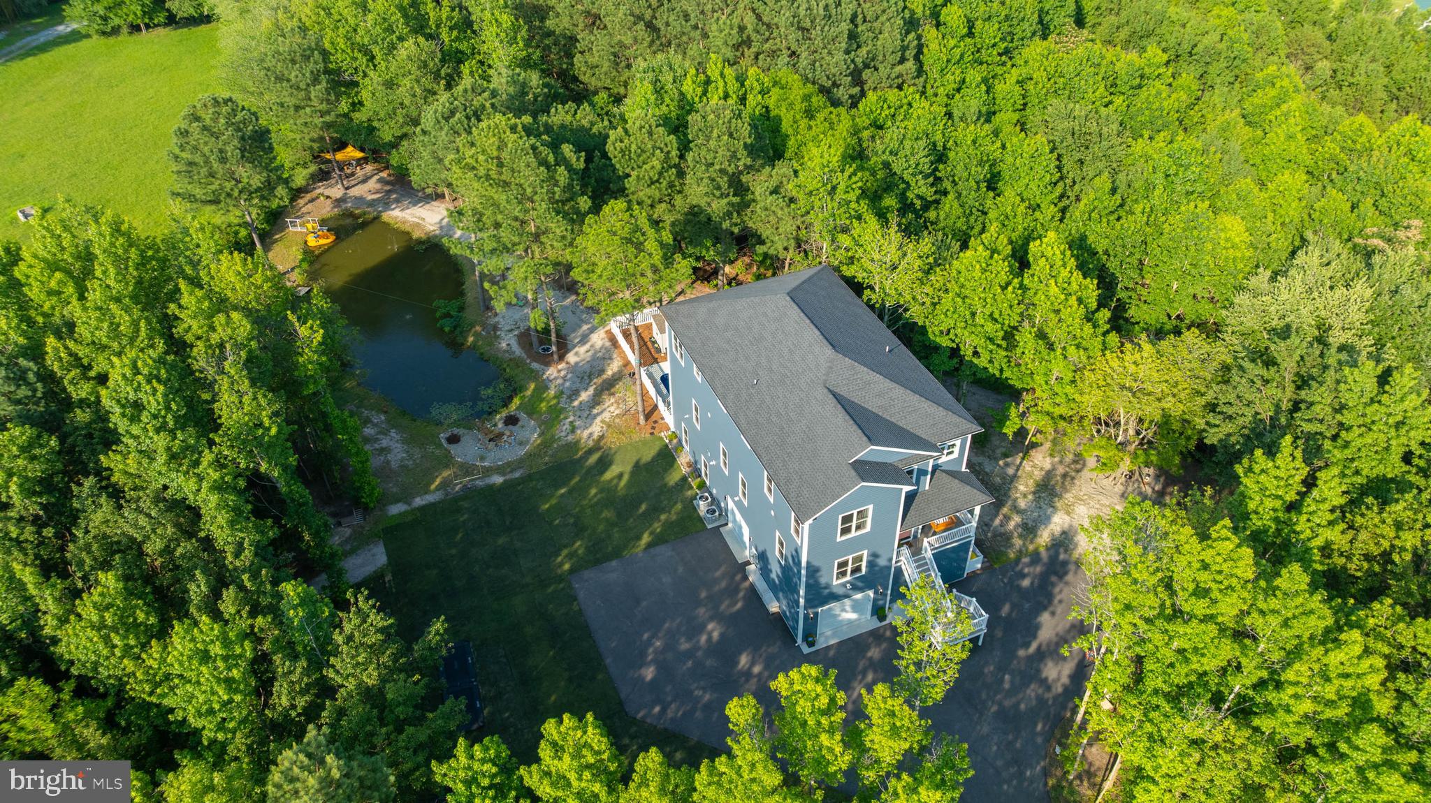 38155 Muddy Neck Road Ocean View, DE 19970 - Photo 53 of 67 a backyard of a house with lots of green space