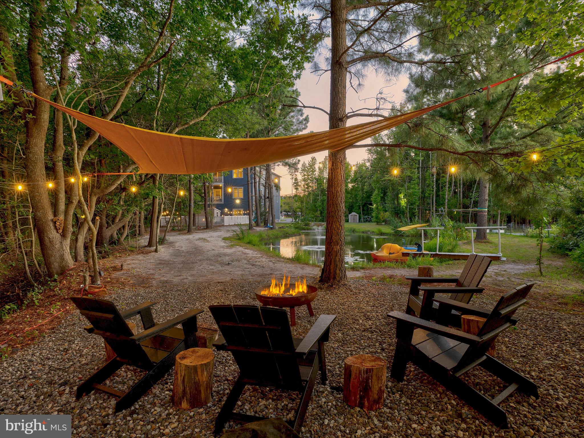 38155 Muddy Neck Road Ocean View, DE 19970 - Photo 57 of 67 a backyard of a house with outdoor seating