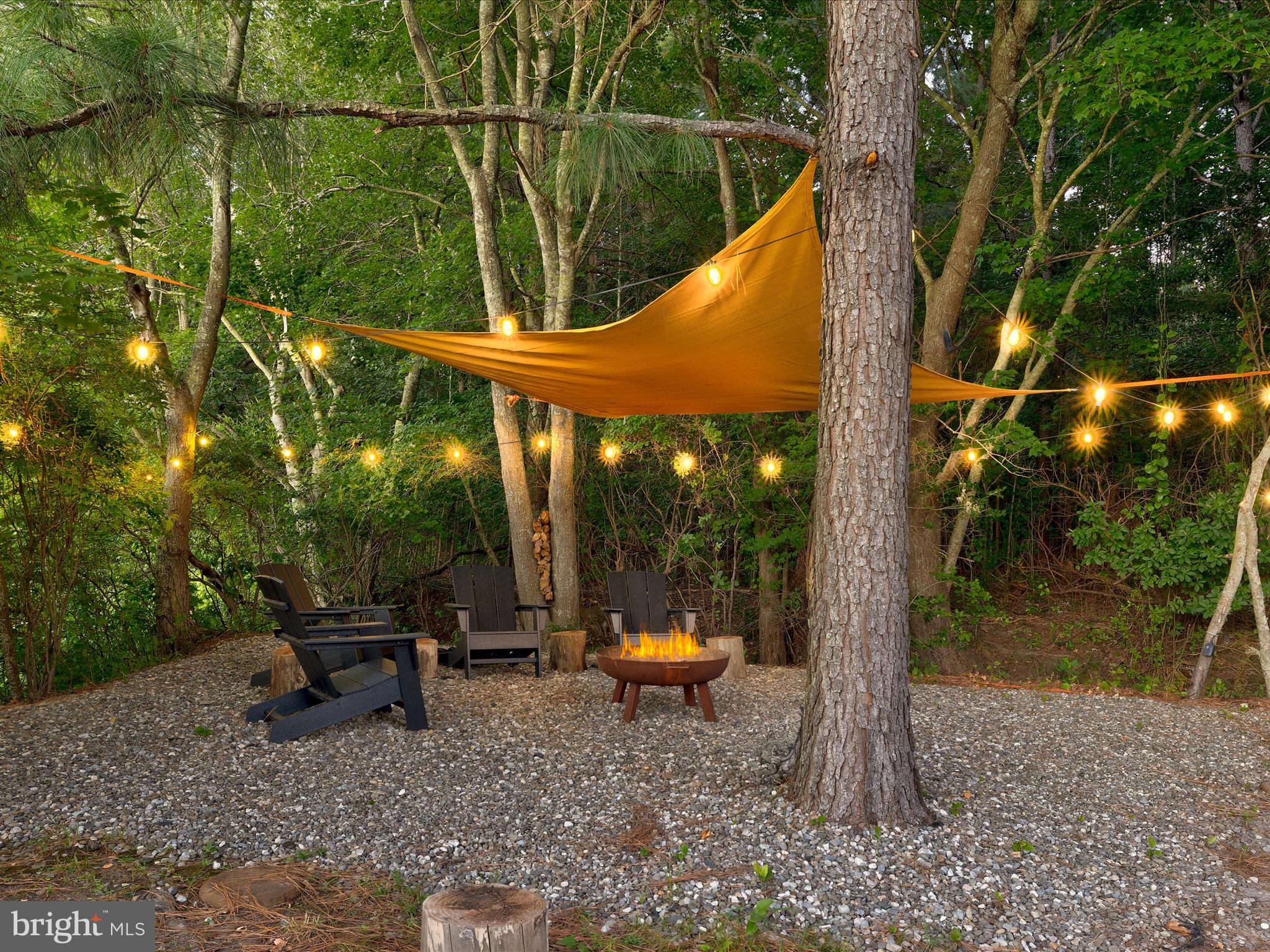 38155 Muddy Neck Road Ocean View, DE 19970 - Photo 59 of 67 a backyard of a house with outdoor seating