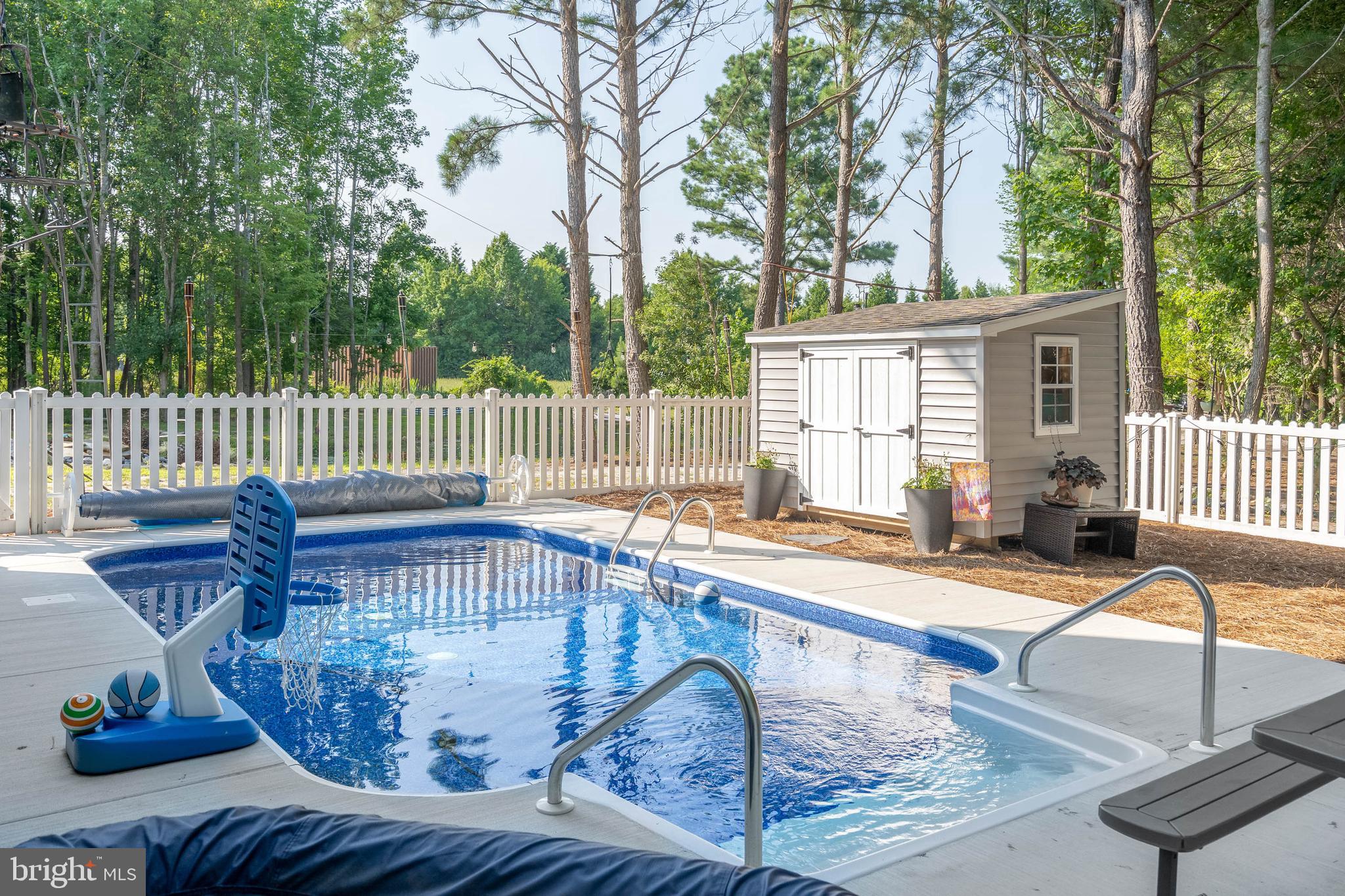 38155 Muddy Neck Road Ocean View, DE 19970 - Photo 6 of 67 a view of a chair and table in the deck