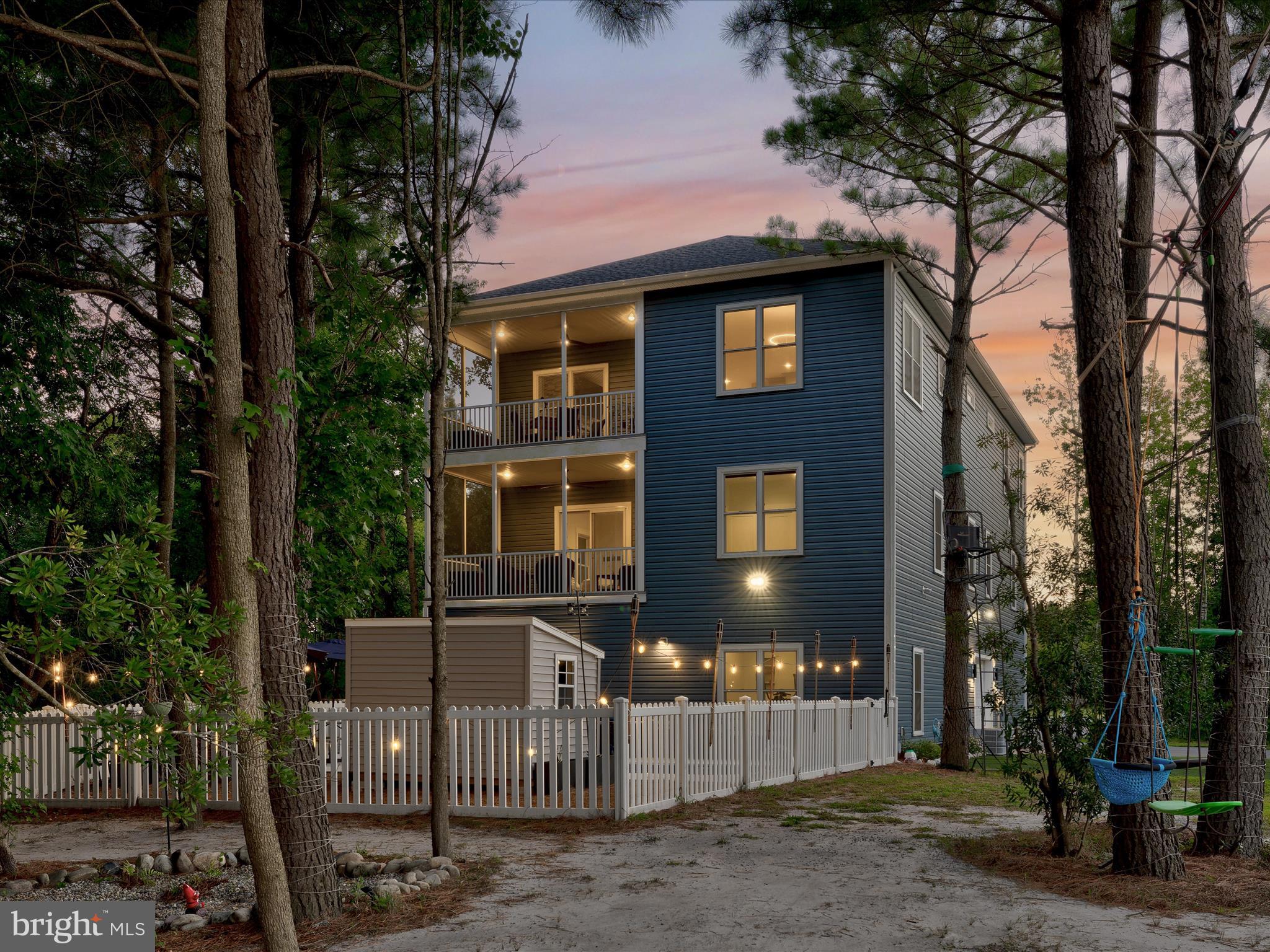 38155 Muddy Neck Road Ocean View, DE 19970 - Photo 62 of 67 a front view of a house with a yard