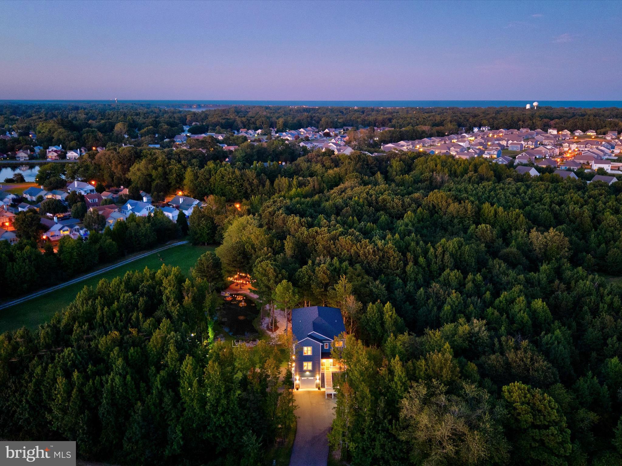 38155 Muddy Neck Road Ocean View, DE 19970 - Photo 65 of 67 a view of a city and a mountain in the background