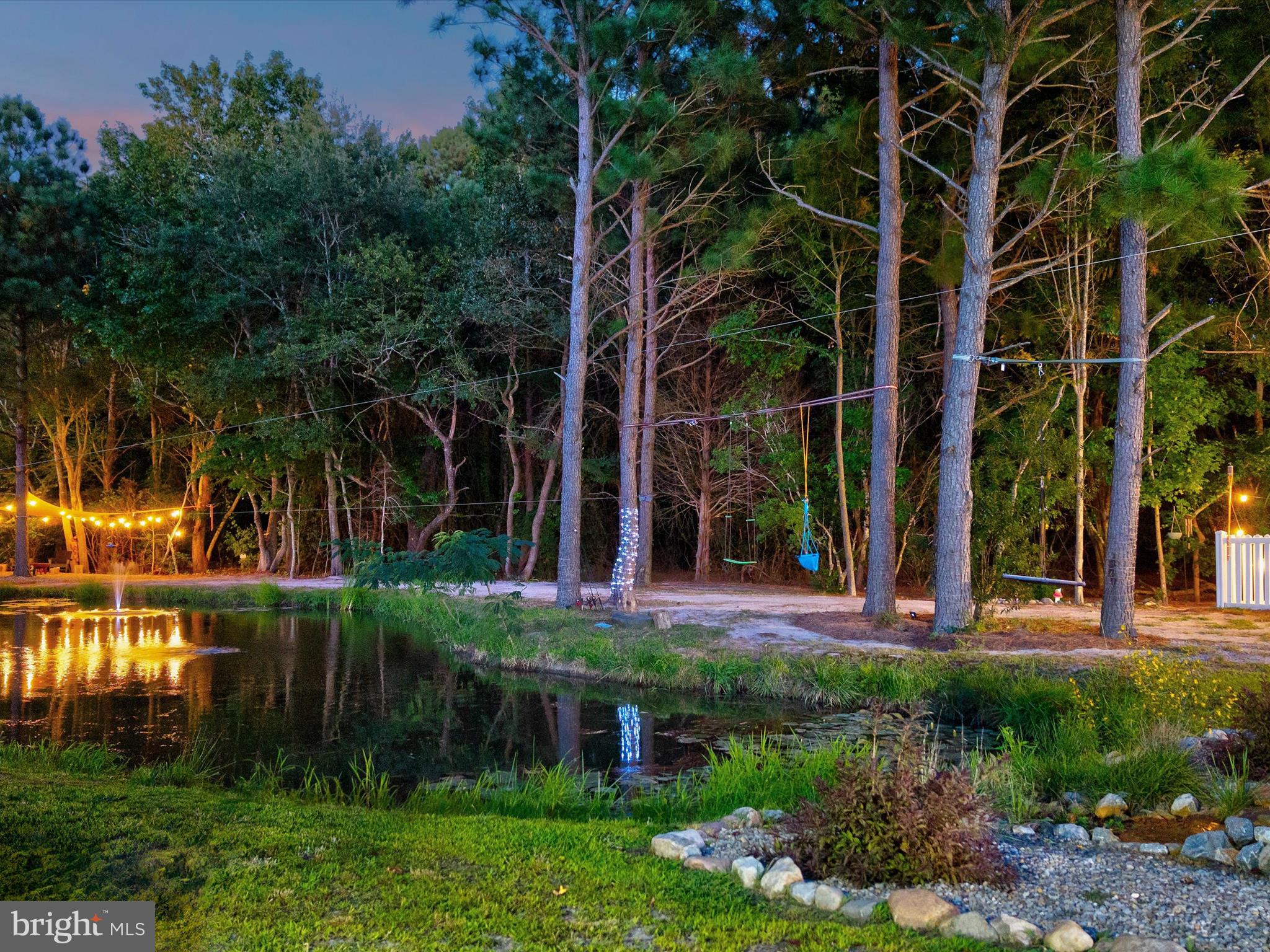 38155 Muddy Neck Road Ocean View, DE 19970 - Photo 67 of 67 a view of a house with a yard and plants