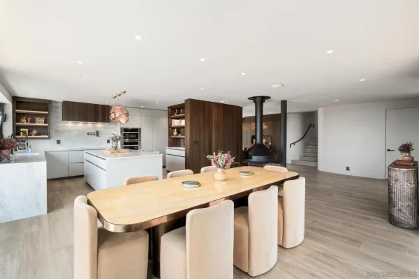 a dinning table and chairs in a kitchen