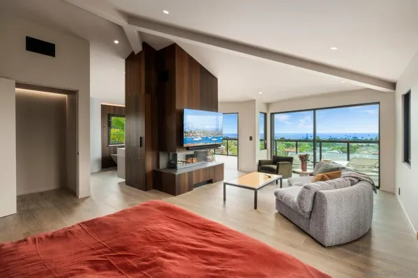 a bathroom with a sink a toilet a mirror and shower