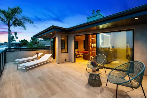 an aerial view of a house with a garden and swimming pool