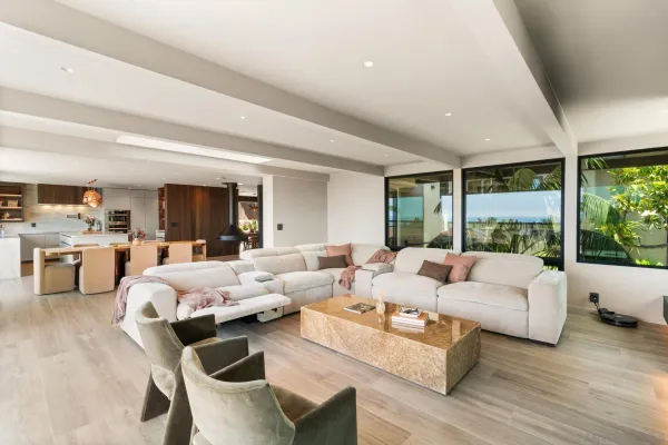 a living room with kitchen island furniture and a large window