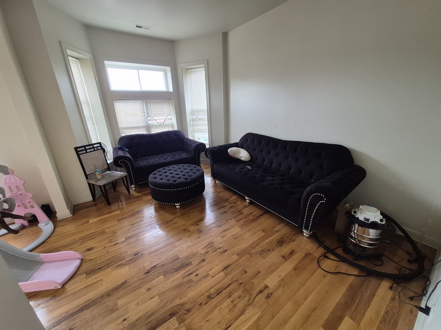 4126 West Adams Street Chicago, IL 60624 - Photo 12 of 19 a living room with furniture and wooden floor