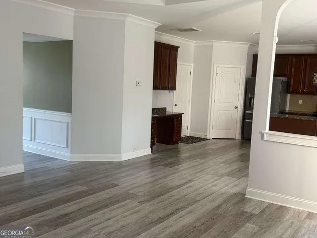 a view of a kitchen from the hallway