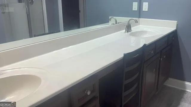 a bathroom with a sink and a mirror