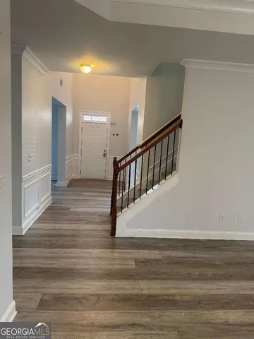 a view of entryway with wooden floor