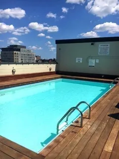 a view of swimming pool with furniture