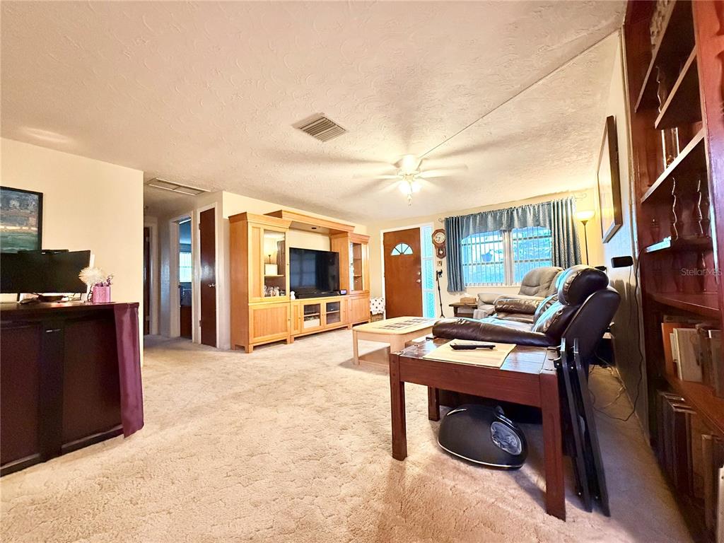 4935 Guardian Avenue Holiday, FL 34690 - Photo 15 of 32 a view of a livingroom with workspace and a window