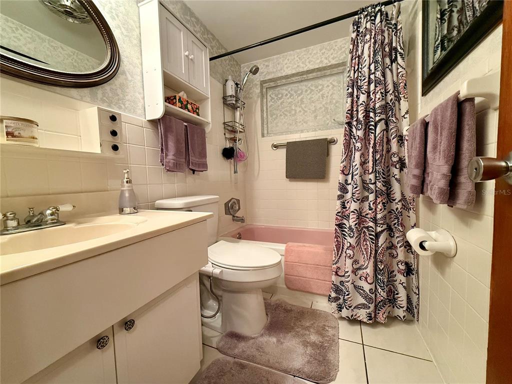 4935 Guardian Avenue Holiday, FL 34690 - Photo 26 of 32 a bathroom with a sink toilet and shower