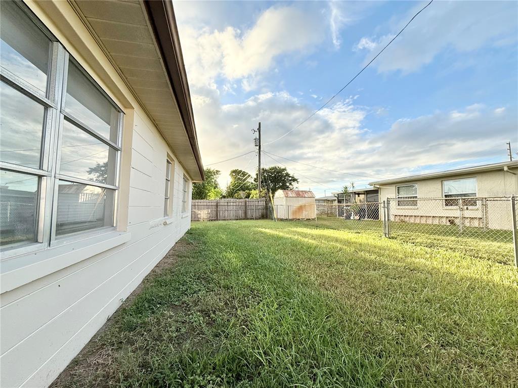 4935 Guardian Avenue Holiday, FL 34690 - Photo 8 of 32 a view of a porch with a big yard