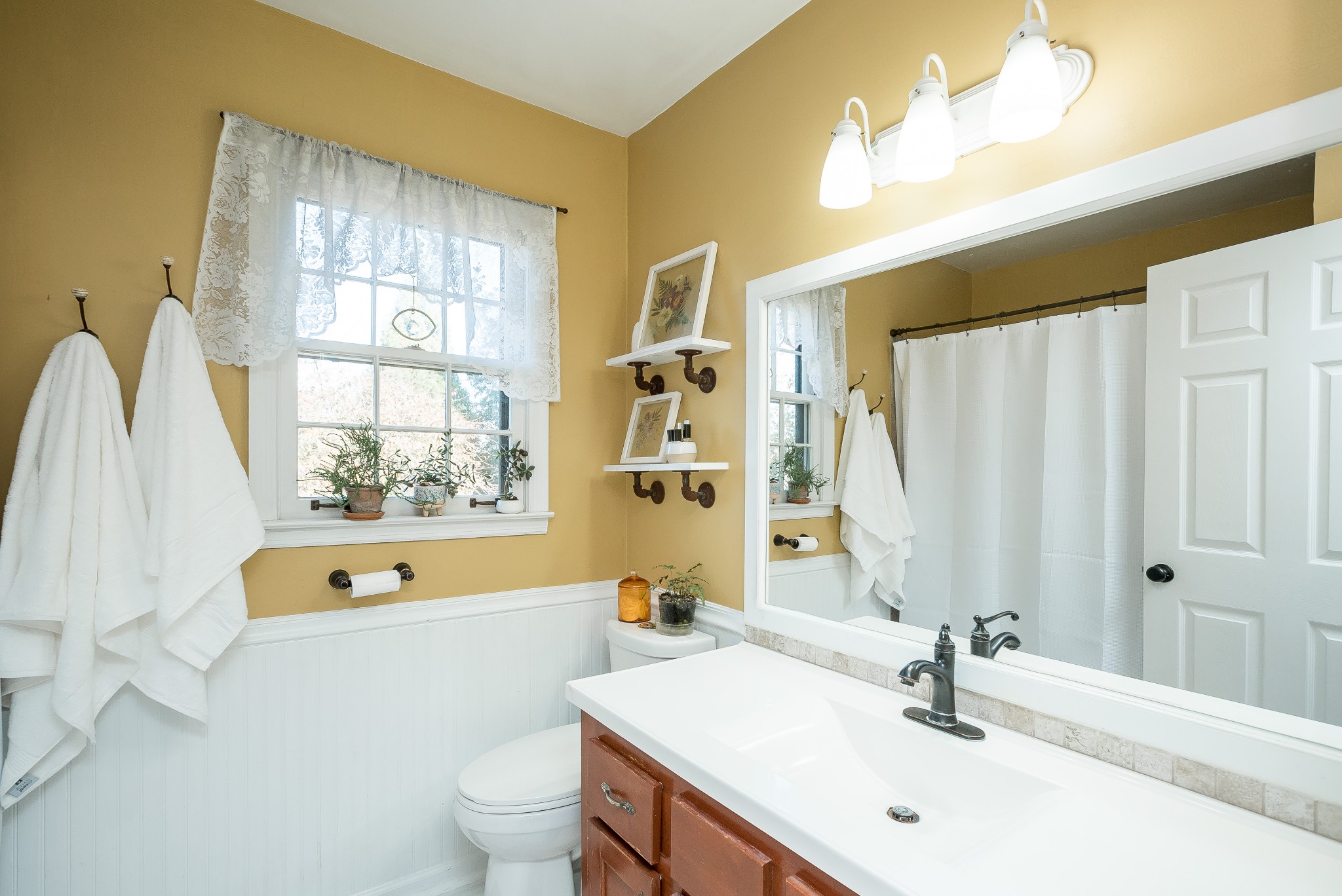 1715 South Walker Road Pleasant View, TN 37146 - Photo 19 of 42 a bathroom with a tub a sink and a large mirror