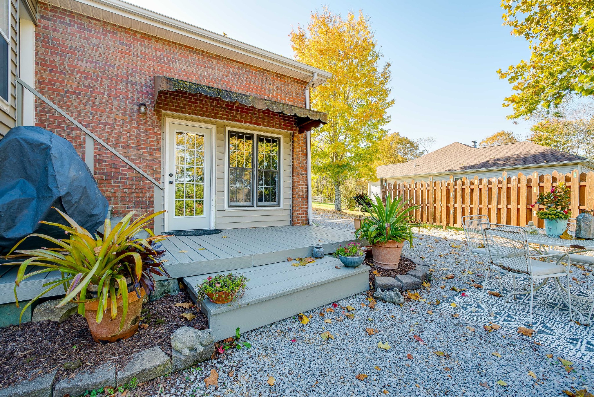1715 South Walker Road Pleasant View, TN 37146 - Photo 36 of 42 a view of a patio with table and chairs and potted plants