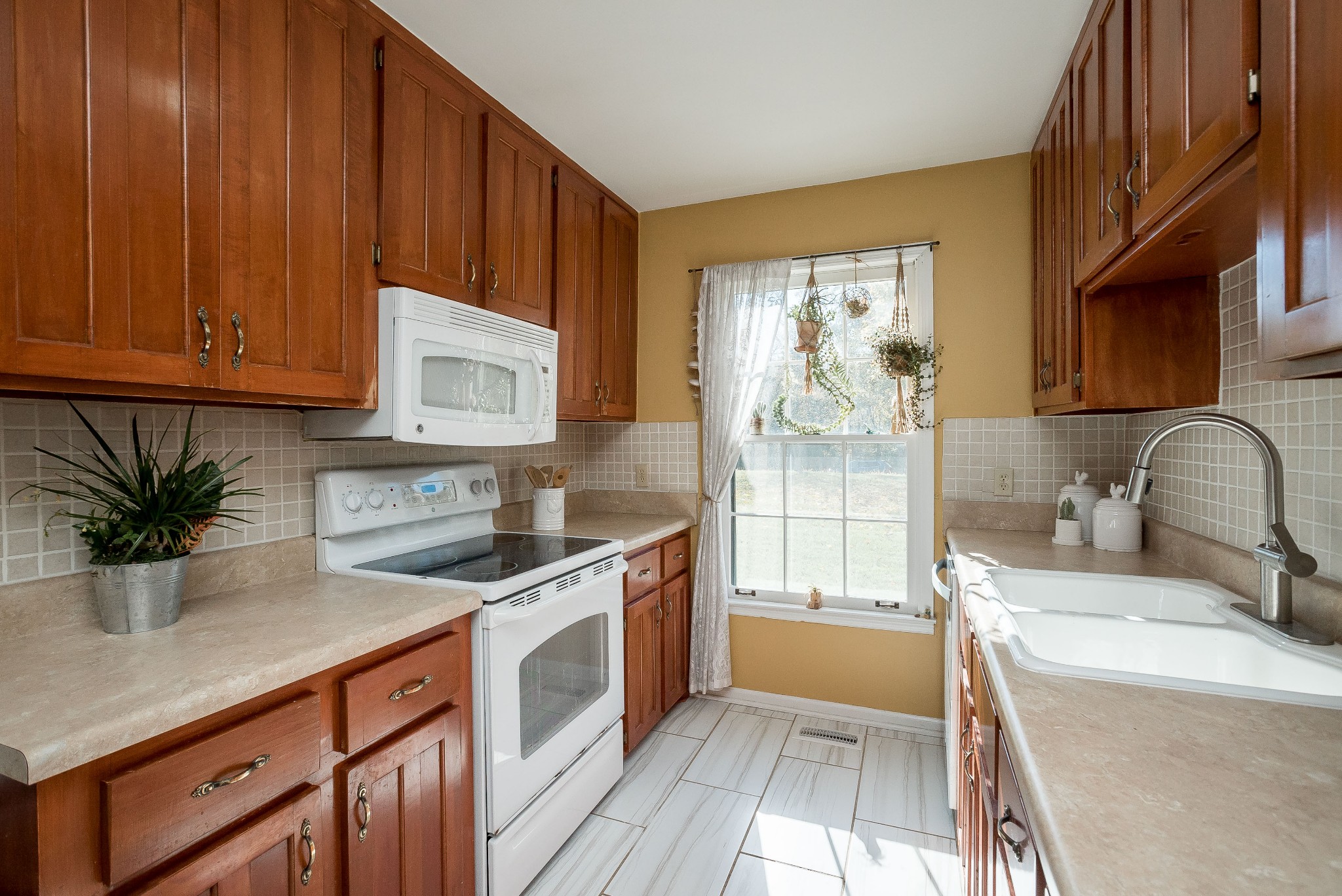 1715 South Walker Road Pleasant View, TN 37146 - Photo 6 of 42 a kitchen with a sink stove and cabinets