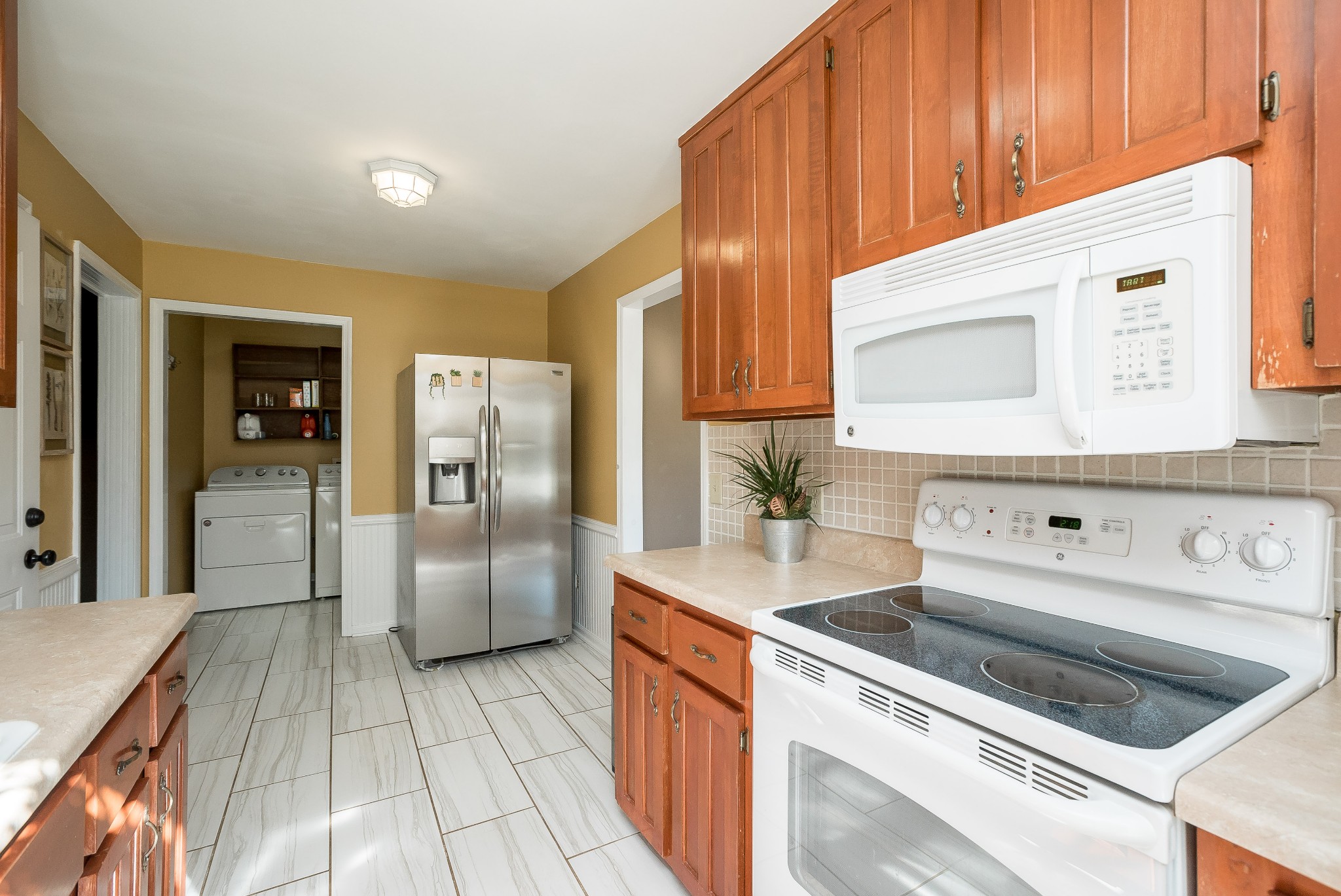 1715 South Walker Road Pleasant View, TN 37146 - Photo 7 of 42 a kitchen with a refrigerator sink and cabinets