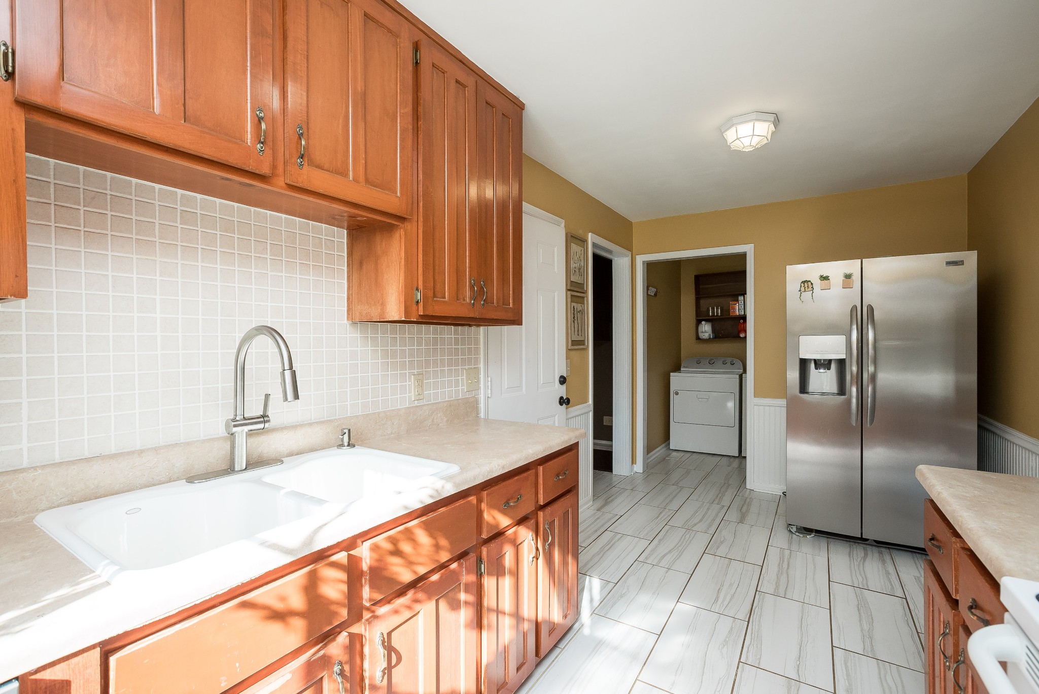 1715 South Walker Road Pleasant View, TN 37146 - Photo 8 of 42 a kitchen with stainless steel appliances granite countertop a sink and a refrigerator