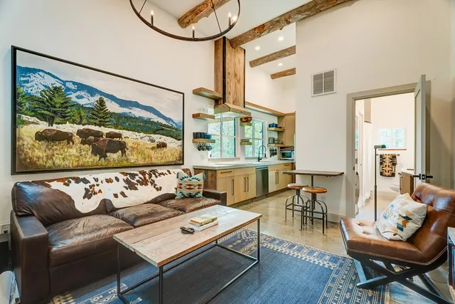 a kitchen with stainless steel appliances granite countertop a sink and a refrigerator