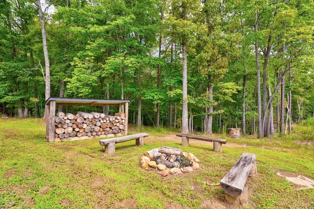 a swimming pool with trees in the background