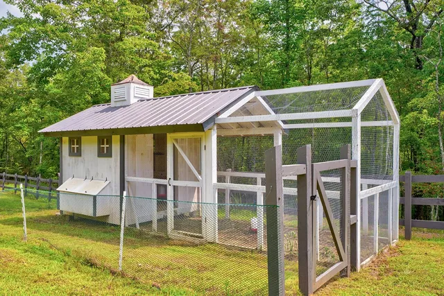 a view of a house with backyard porch and sitting area