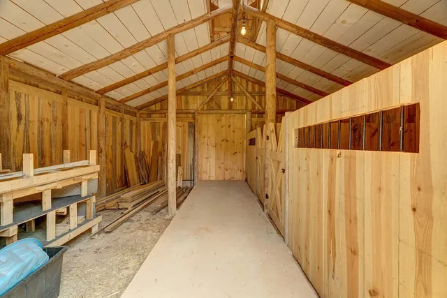 a view of a lush green mountain in front of a house