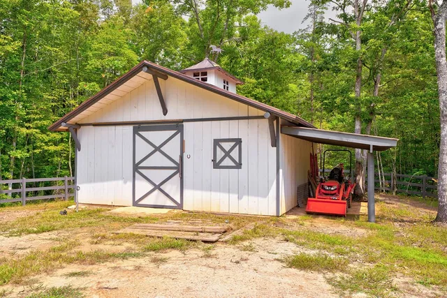 a backyard of a house with yard and outdoor seating