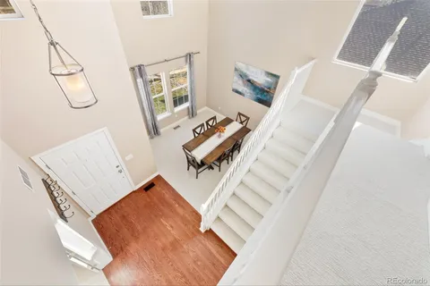 a view of living room with furniture and a fireplace