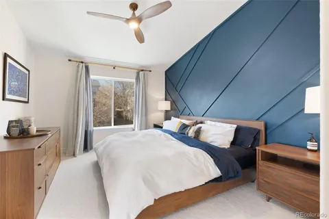 a bedroom with bed and window